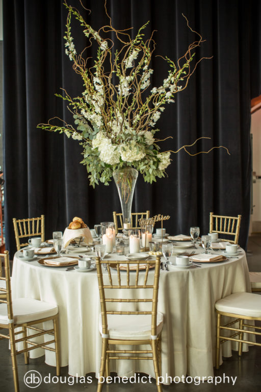 white and green sticks and orchid high centerpieces