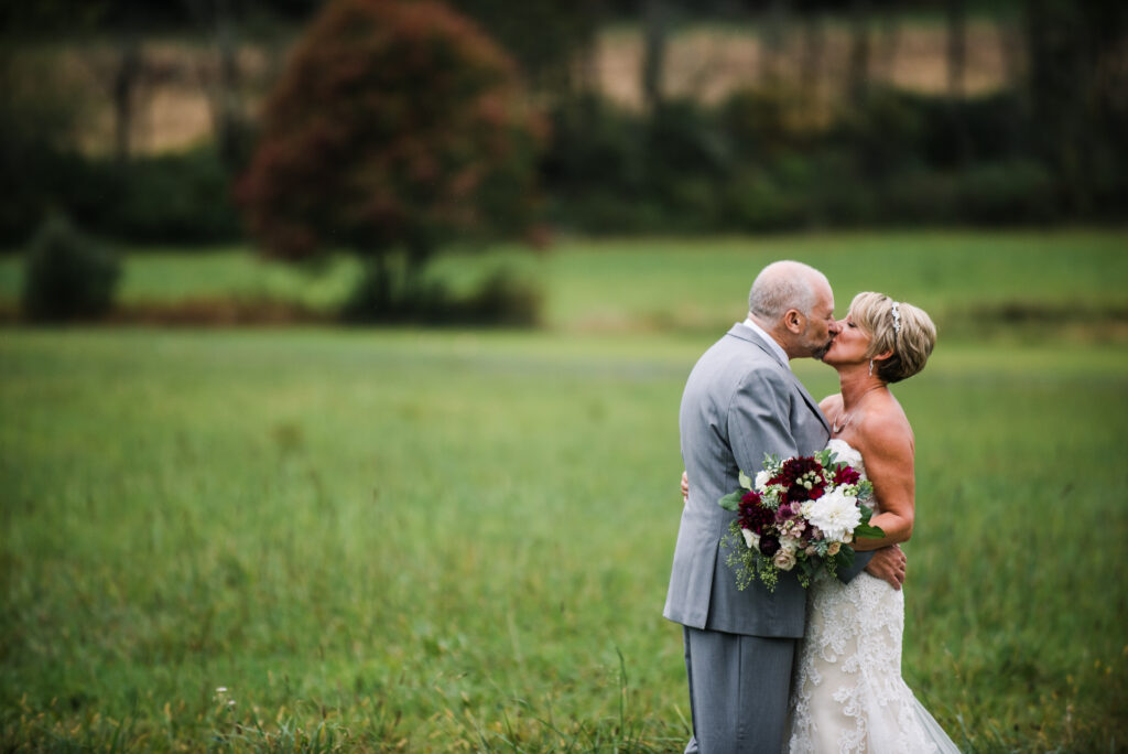 Burgundy, blush, red, greenery, roses, dahlias, rustic chic wedding, bride and groom