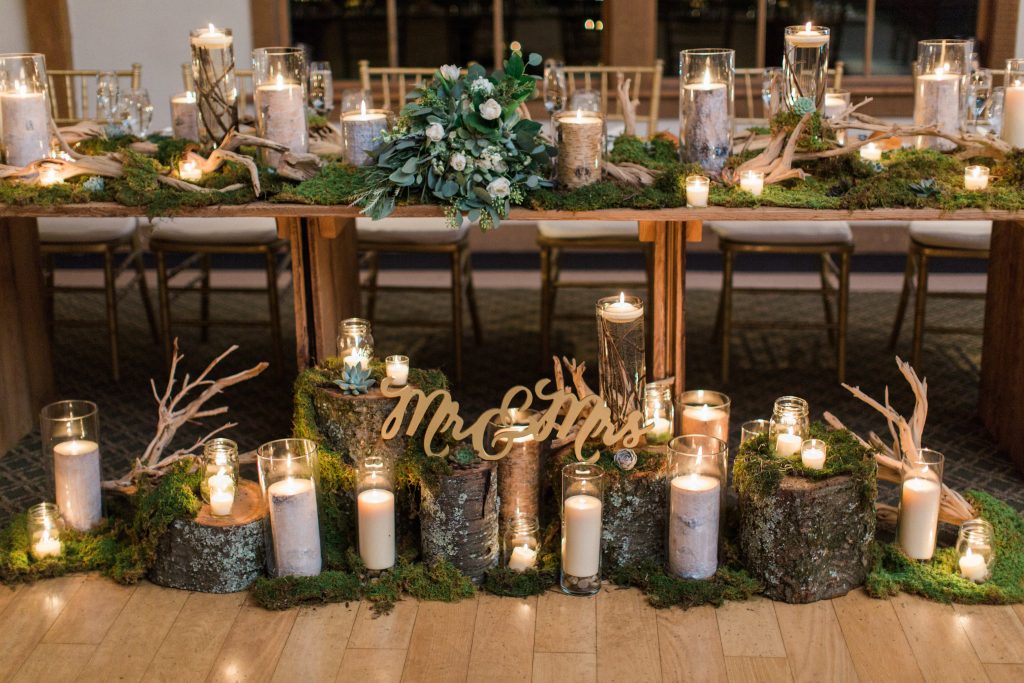 Green, white, cream, blush, eucalyptus, wedding, moss and wood stumps, candles sweatheart table.