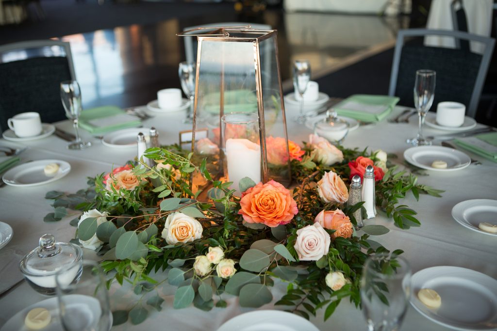 Fall, wedding, secret garden, vintage, viney, blush, peach, muted orange, roses, spray roses, king protea, greenery, birch, dahlias, lantern, greenery, florals, centerpiece.