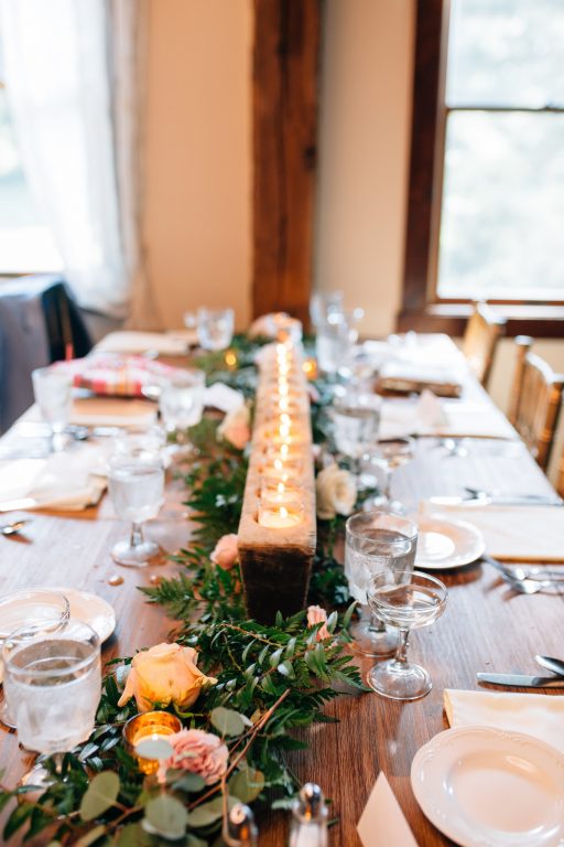 Summer wedding, natural, greenery, light, fresh, peonies, juliet roses, cream, pink, blush, reception, centerpiece. wood slab, candles, greenery, roses.