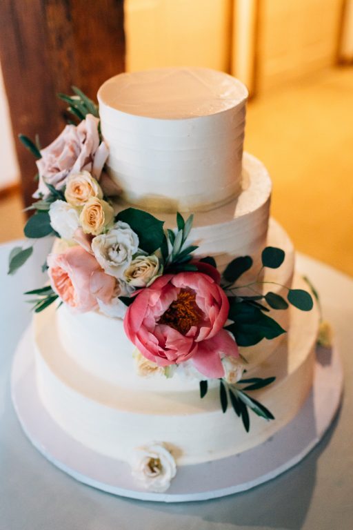 Summer wedding, natural, greenery, light, fresh, peonies, juliet roses, cream, pink, blush, reception, cake, floral swag.