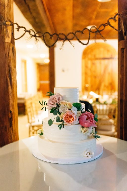 Summer wedding, natural, greenery, light, fresh, peonies, juliet roses, cream, pink, blush, reception, cake, floral swag.