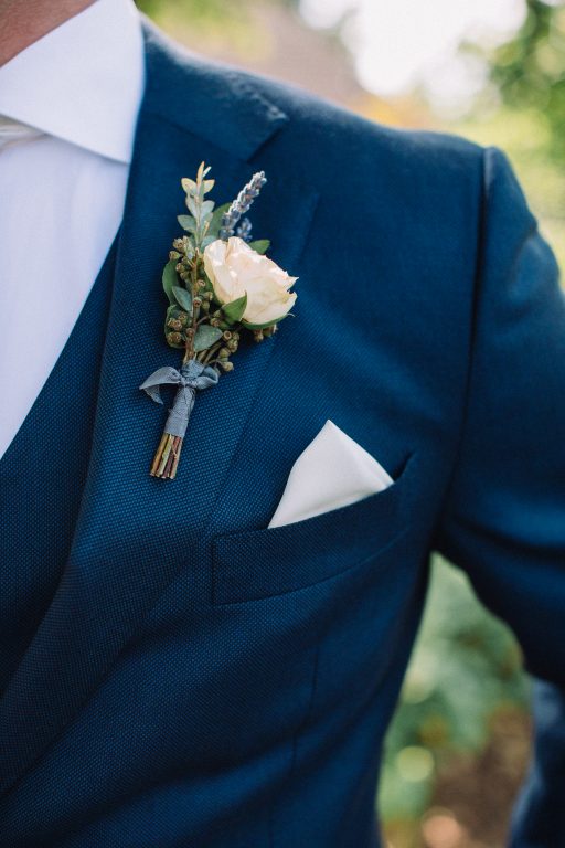 Whimsical, fall, autumn, jewel tones, gardeny, greenery, purples, blues, organic, wedding, groom, boutonniere.