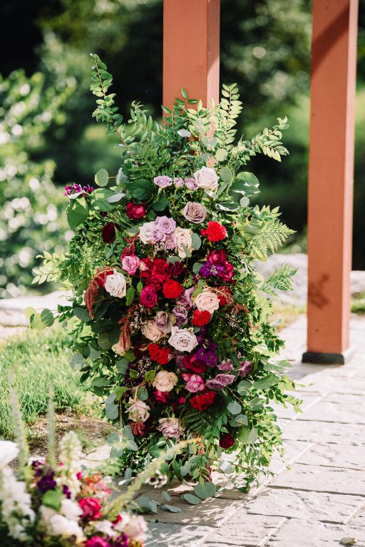 Whimsical, fall, autumn, jewel tones, gardeny, greenery, purples, blues, organic, wedding, arbor, corner pieces, florals, ceremony decor.