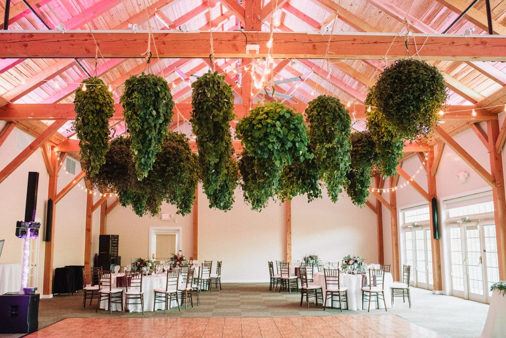 Whimsical, fall, autumn, jewel tones, gardeny, greenery, purples, blues, organic, wedding, greenery chandeliers.