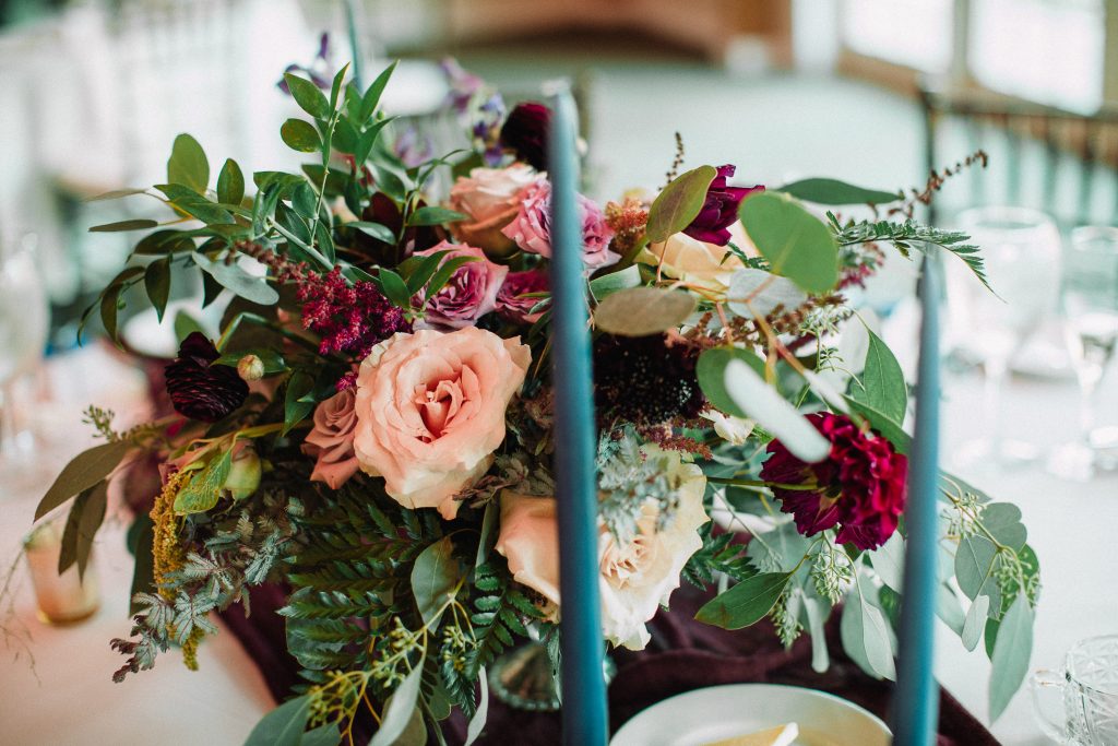 Whimsical, fall, autumn, jewel tones, gardeny, greenery, purples, blues, organic, wedding, centerpiece.