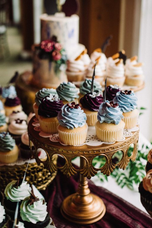 Whimsical, fall, autumn, jewel tones, gardeny, greenery, purples, blues, organic, wedding, dessert display, gold cake stands.