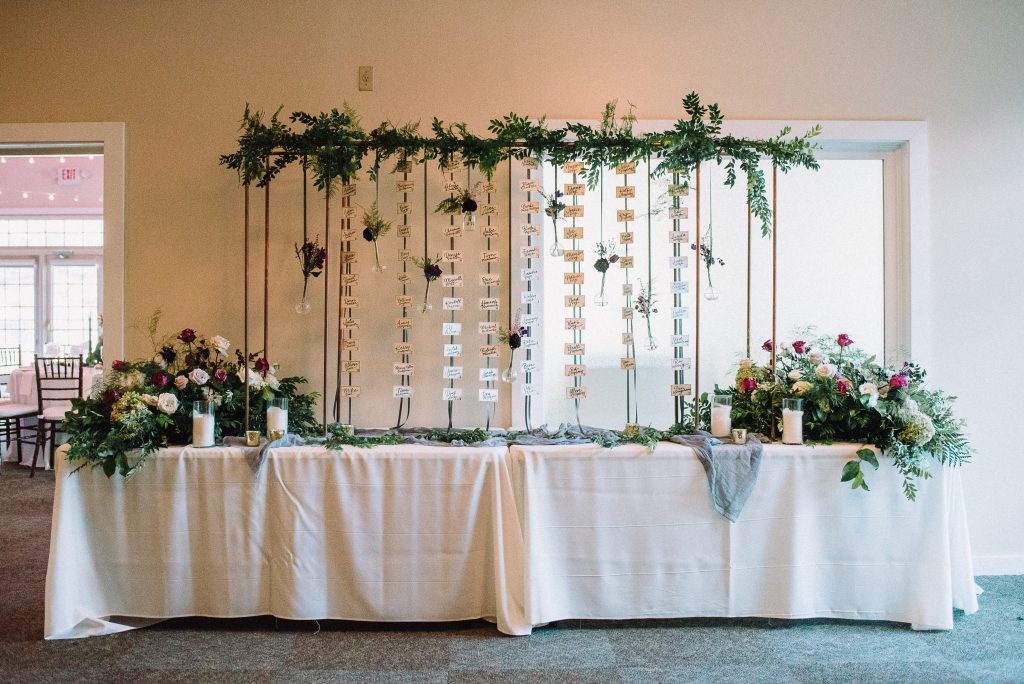 Whimsical, fall, autumn, jewel tones, gardeny, greenery, purples, blues, organic, wedding, escort card display.