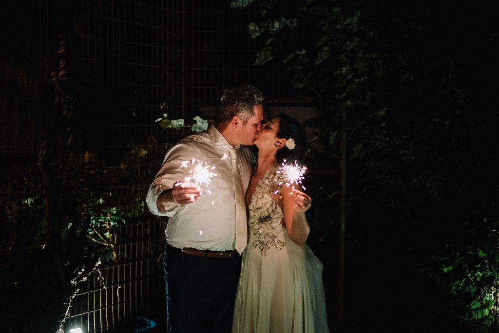 Whimsical, fall, autumn, jewel tones, gardeny, greenery, purples, blues, organic, wedding, bride and groom, sparklers.