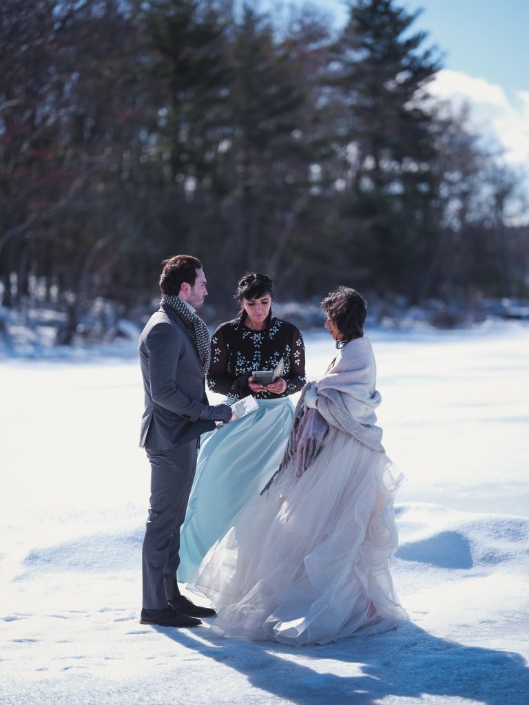 Ice wedding, ice dinner, tule bridal skirt, blush, burgundy, brown, dried florals, winter, frozen lake, styled shoot, bride and groom, ceremony.