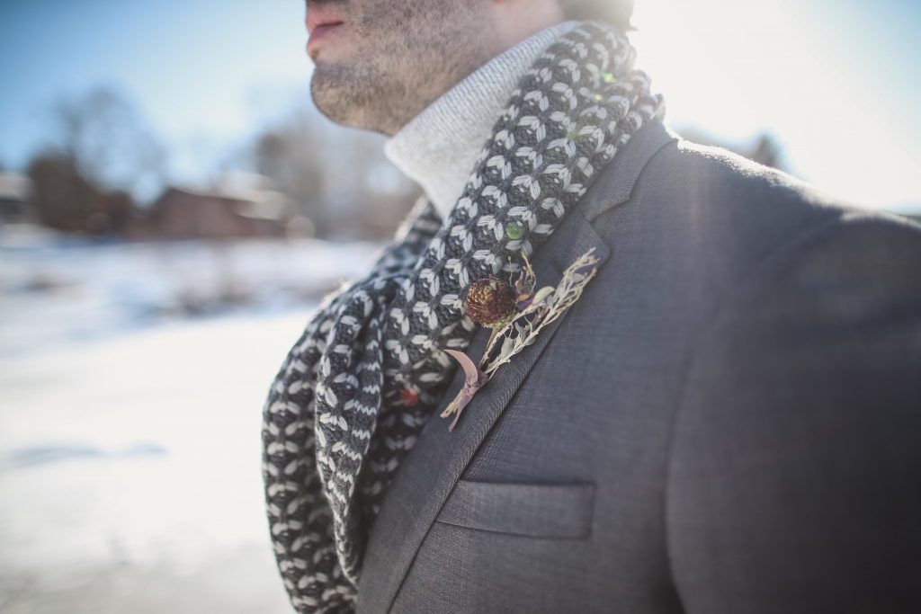 Ice wedding, ice dinner, tule bridal skirt, blush, burgundy, brown, dried florals, winter, frozen lake, styled shoot, groom, scarf, boutonniere.