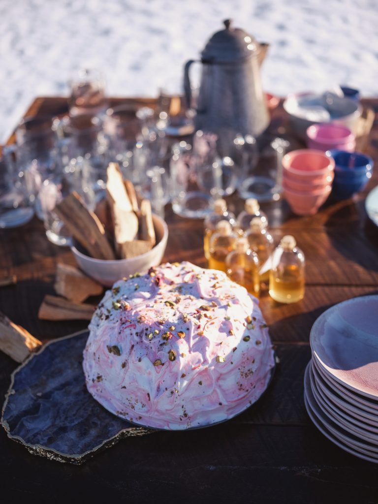 Ice wedding, ice dinner, tule bridal skirt, blush, burgundy, brown, dried florals, winter, frozen lake, styled shoot, dinner, dessert.