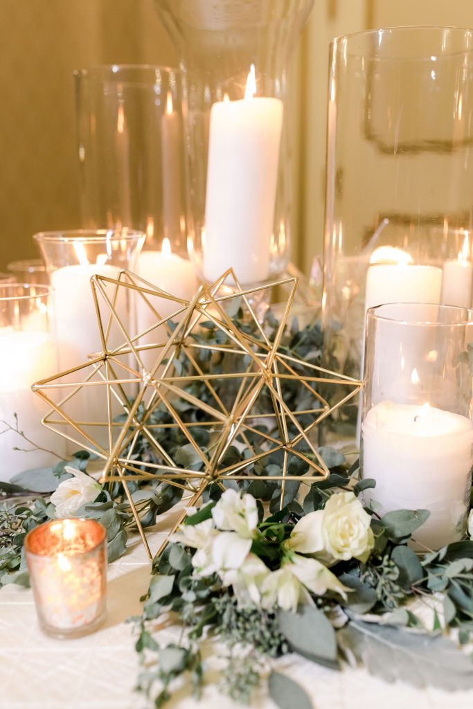 grey-green, plum, cream and a hint of blush, traditional, modern, winter wedding, roses, spray roses, ranunculus, candles, moravian stars, centerpieces.