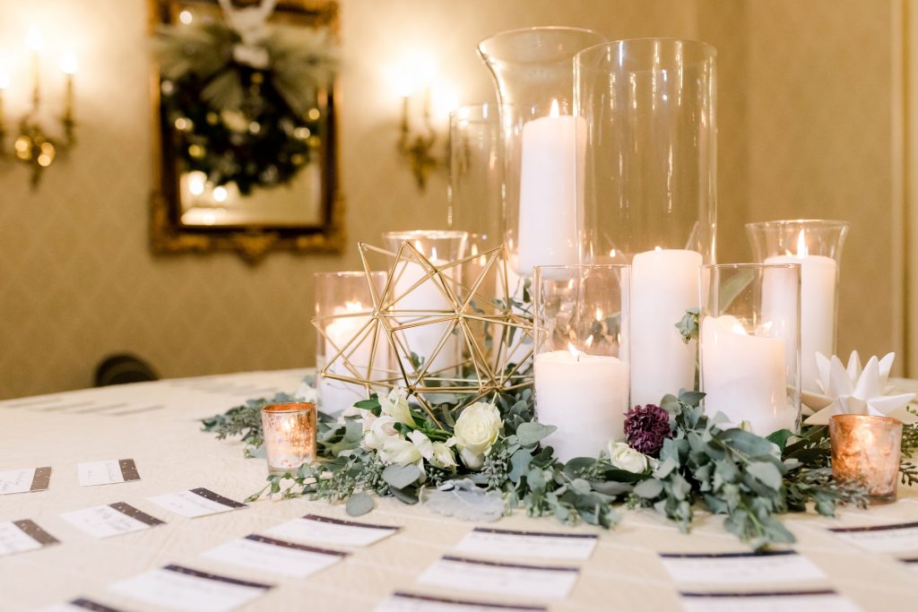 grey-green, plum, cream and a hint of blush, traditional, modern, winter wedding, roses, spray roses, ranunculus, candles, moravian stars, centerpieces.