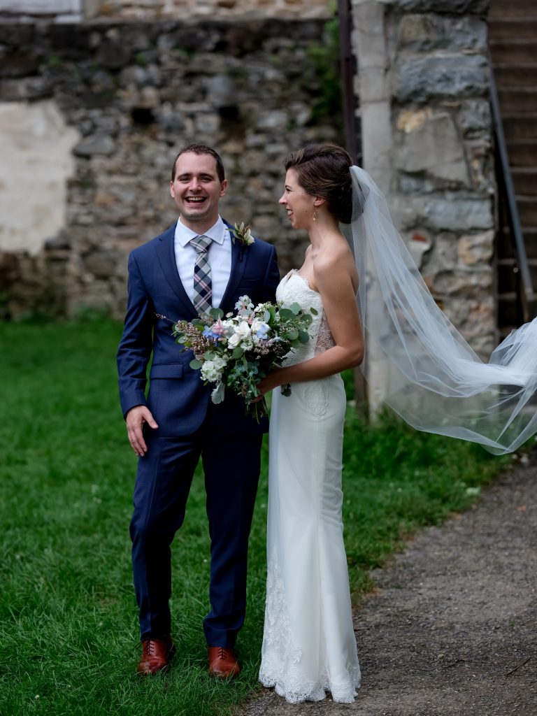 warm, loving, striking and fashionable, artistic, fall wedding, navy, slate bluish, pewter, blush, cream, greenery, texture, botanical, asymmetrical, bride and groom, first look.