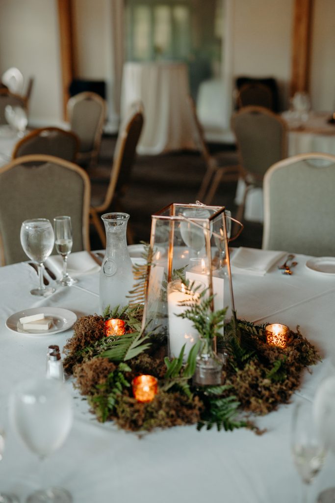 Summer wedding, fun, party of the summer, greens, ferns, forest greens, rose gold, copper, cream, lanterns, moss, centerpiece.